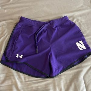 Purple athletic shorts under armour